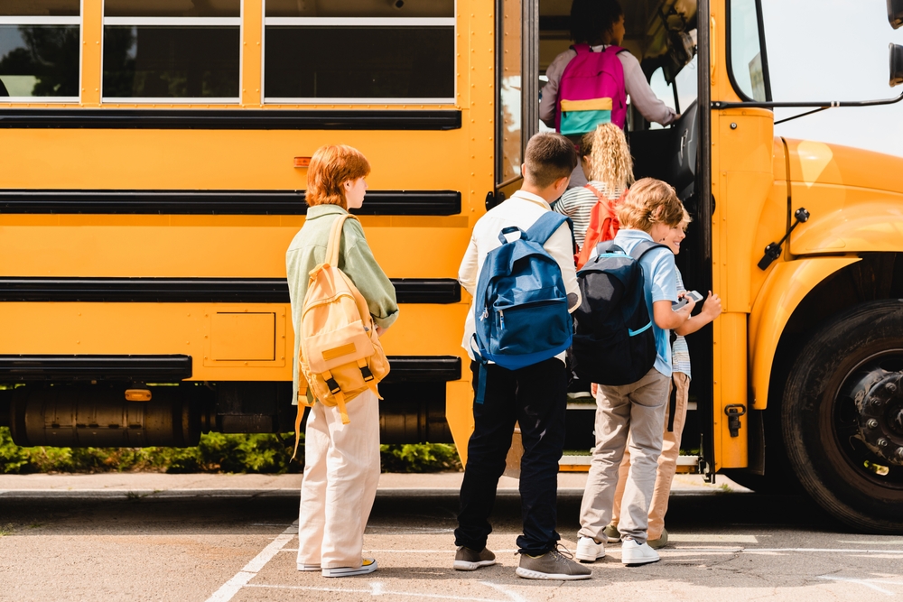 Kids entering school bus in conroe texas